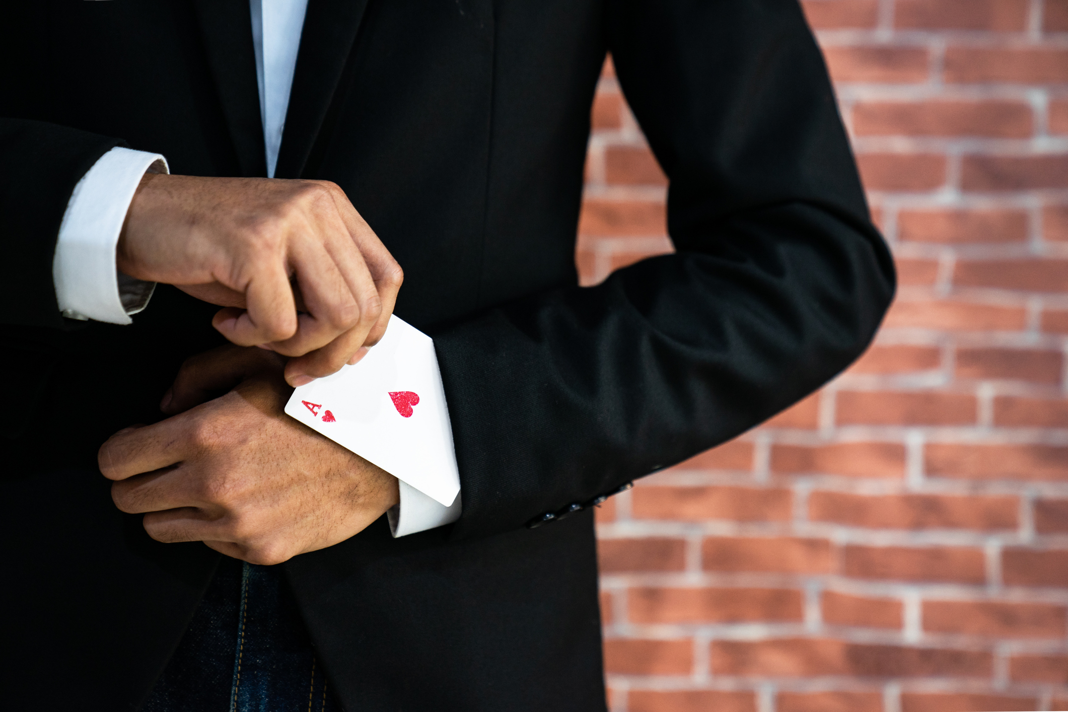 Abstract image of Business man with ace in his sleeve for "Open banking poker—Winner takes all"