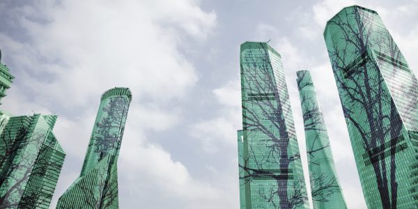 Composite image of trees on buildings in city as metaphor for ESG-investing on the rise