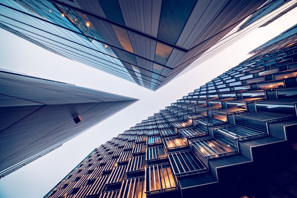 Looking directly up at the skyline as metaphor for "Inflation on the horizon – bank stocks are rallying"