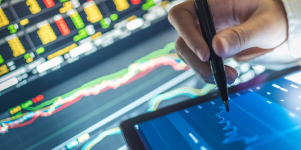 Business analysis stockmarket chart in tablet and computer for investment in crisis as metaphor for "Professionalizing revenue management in banking"